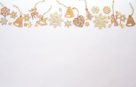 lots of wooden toys for the Christmas tree. Isolated white background top view. Space for text.の写真素材