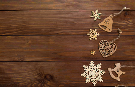 lots of wooden toys for Christmas tree on wooden background top view.の写真素材
