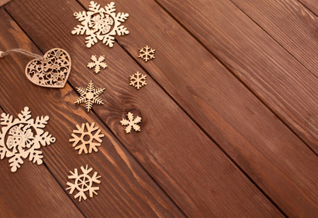 lots of wooden toys for Christmas tree on wooden background top view.の写真素材