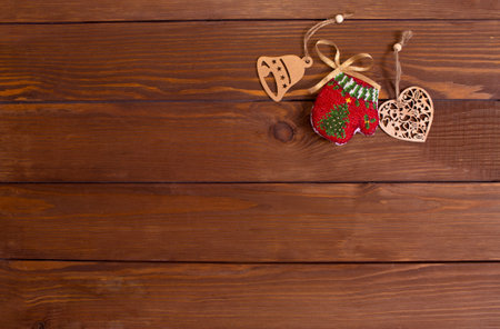 lots of wooden toys for Christmas tree on wooden background top view.の写真素材