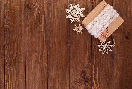 lots of wooden toys for Christmas tree on wooden background top view.の写真素材