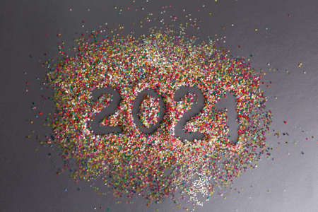 multicolored confetti on a gray background 2021 year inscriptionの写真素材