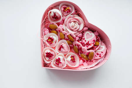 Pink heart-shaped box with brownies inside sprinkled with nuts. Valentine's Day Gifの写真素材