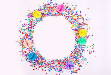 multicolored small confetti on a white background. Top view.の写真素材