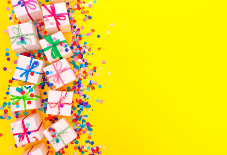 colorful gift boxes and Chinese lanterns on a yellow background top view.の写真素材