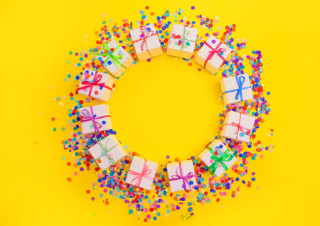 colorful gift boxes and Chinese lanterns on a yellow background top view.の写真素材
