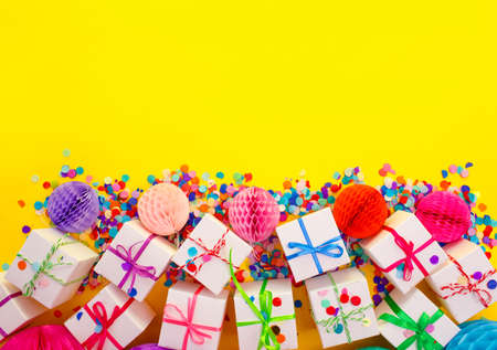 colorful gift boxes and Chinese lanterns on a yellow background top view.の写真素材