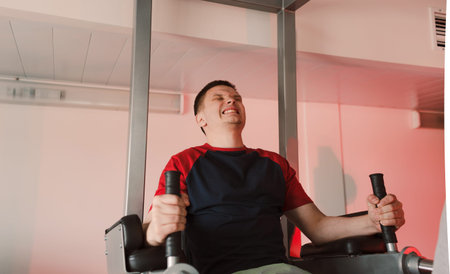 Athlete, fitness club, exercises on the uneven bars, sports equipment. Abdominal muscle training,...