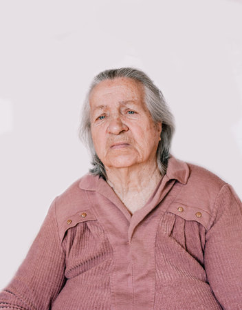 a large portrait of a grandmother with deep wrinkles and old age spots on her face