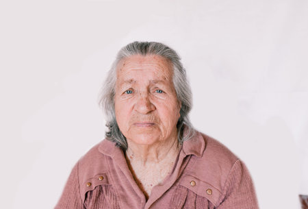 large portrait of an old woman on an isolated white background