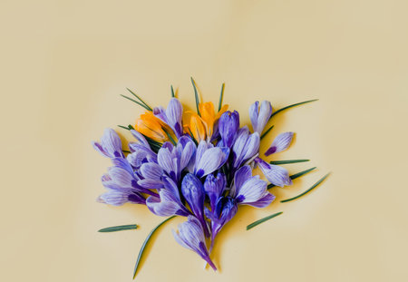 a bouquet of blue flowers on a yellow isolated background. color of the year. floristics