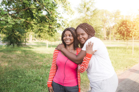 two girls having fun together, joy, positivity, love, friendship, sisters. Happy meeting of two friendsの写真素材