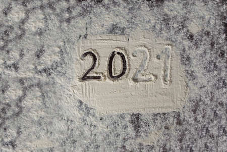 Abstract background of a photo of the outgoing year 2021. Flour drawing.の写真素材