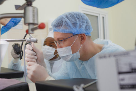 the doctor, together with an assistant, conducts a proctological medical examination of the patient in the treatment room.の写真素材