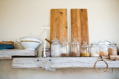 glass jars for storing food in the kitchen. order on the shelves and environmentally friendly storage.の写真素材