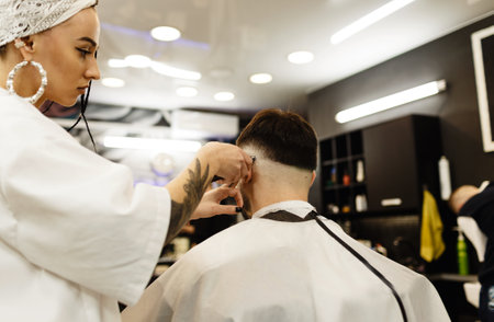 Men's haircut in a barber shop. Men's hair salon. Barbershop.の写真素材