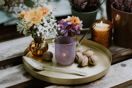 Wedding table setting with glasses, candles and flowersの写真素材