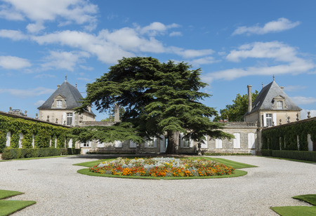 Chateau Beychevelle in Saint Julien in Medoc with garden and big fir tree, France.のeditorial素材