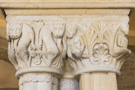Statues on a pillar on a church in Paray le Monial in France.の写真素材