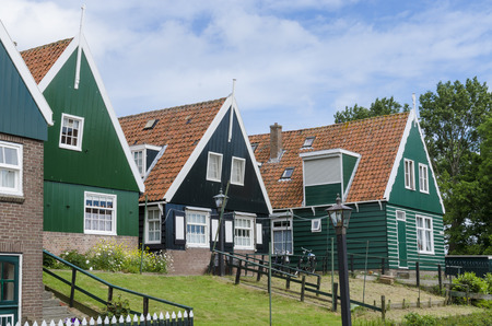 A few typical wooden houses on the former isle of Marken in the Netherlands.のeditorial素材