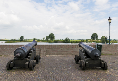 Two cannons at the river in the harbor of Heusden.のeditorial素材