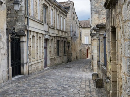 Old Street with cobble stones ands old stone houses in the wine city of Saint-Emilion.のeditorial素材