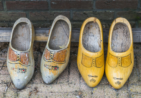 Two old pair of wooden shoes.の写真素材