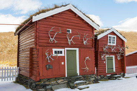 Two old red cabins National Park Dovrefjell Hjerkinn in Norwayのeditorial素材
