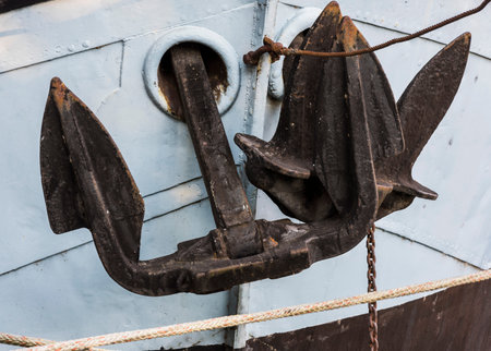 Two black anchors on alight blue ship in Dordrecht, the Netherlands.の写真素材