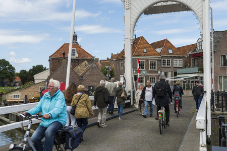Enkhuizen, The Netherlands - August 9, 2016: Tourists on a draw-bridge in Enkuizen.のeditorial素材
