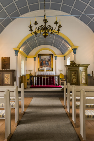 Hrepphola, Iceland - June 26, 2016: Interior of Hreppholakirkja, wooden church with white benches and blue ceiling in Iceland.のeditorial素材