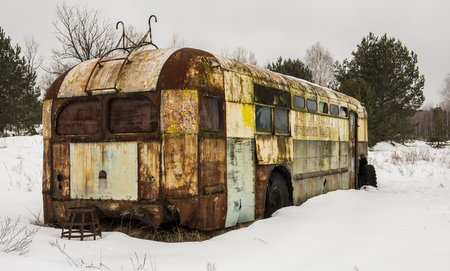 Rusty metal caravan in Chernobyl in the Exclusion zone in the Ukraine in wintertime.の写真素材