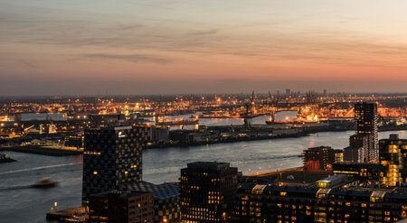 Nieuwe Maas in Evening Light with ships on the river, industrial areas and the harbor of Rotterdam...