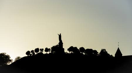 The statue of Pope Urbanus 2 in the Champagne village of Chatillon-sur-Marne in the Champagne district in France during sunset.の写真素材