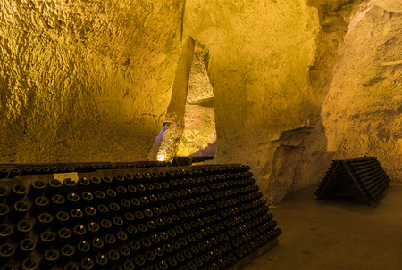 Reims, France - June 12, 2017: the caves of Champagne House Taittinger with old bottles Champagne in pupitres, France.のeditorial素材