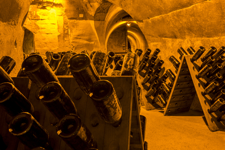Reims, France - June 12, 2017: the caves of Champagne House Taittinger with old bottles Champagne in pupitres, France.のeditorial素材