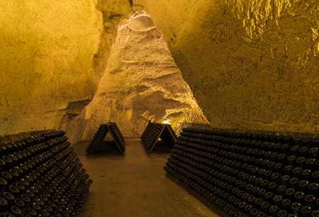 Reims, France - June 12, 2017: the caves of Champagne House Taittinger with old bottles Champagne in pupitres, France.のeditorial素材