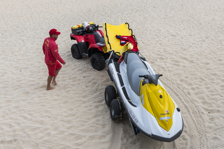Saint Ives, England - April 29, 2017: Lifeguard on the beach with quad and jet ski.のeditorial素材