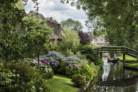 Giethoorn, The Netherlands - July 30, 2016:  Front with Hydrangea of a monumental house in the small, picturesque town of Giethoorn, Overijssel, Netherlands.のeditorial素材