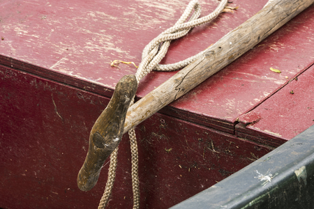 Punter stick on an old boat in Giethoorn, Overijssel, Netherlands.の写真素材