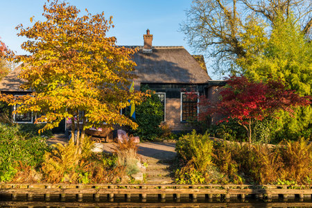 Giethoorn, The Netherlands - October 31, 2016:  Picturesque house in autumn in the small village of Giethoorn in Overijssel, Netherlands.のeditorial素材