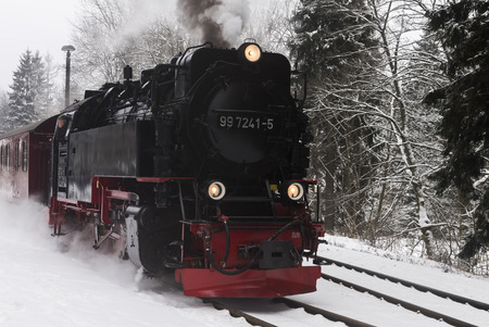Drei Annen Hohe, Germany - February 4, 2018: Steam locomotive of the Harzer Schmallspurbahnen in wintertime with snow.のeditorial素材