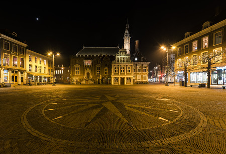 Haarlem, The Netherlands - February 20, 2018: Square and town hall at the Grote Markt at night with monumental houses in Haarlem.のeditorial素材