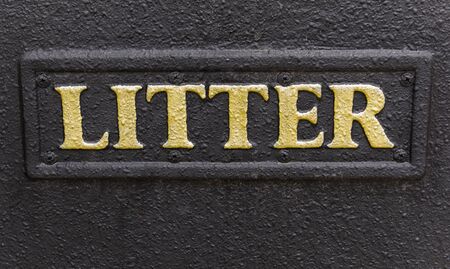Lymington, England - October 25, 2018: The golden word Litter on a black trash can.のeditorial素材