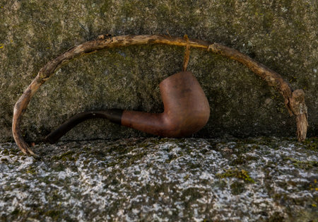 Minstead, England - October 22, 2018: gravestone with pipe of Arthur Conan Doyle, writer of the...