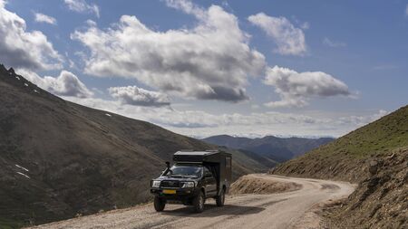 Erikidibi, Turkey - May 6, 2019: Car 4x4 on a pass in the Pontic Mountains with snow and unpaved road.のeditorial素材