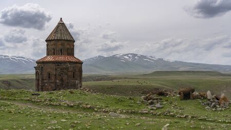 Ani, Turkey - May 9, 2019: Ruins of the old Armenian town Ani with churche and in the background snowy mountains, Turkey.のeditorial素材