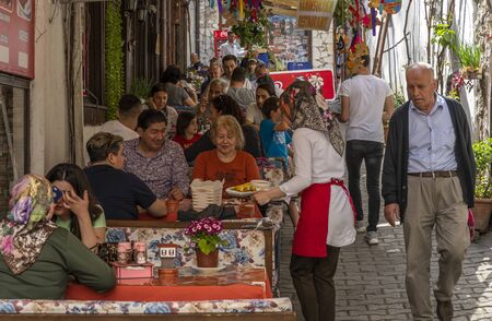 Safranbolu, Turkey - May 1, 2019:  Touristic village with tourists at one of the main streets with restaurants and cafes.のeditorial素材