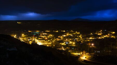 Digor, Turkey - May 9, 2019: Lightning and thunder in  the town of Digor with houses, lights and a mosque, Turkey.のeditorial素材