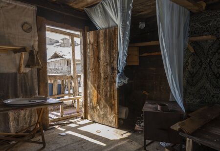 Koprulu, Turkey - May 9, 2019: Interior of a abandoned log cabin in the small village of Koprulu in the snow in Artvin, Turkey.のeditorial素材